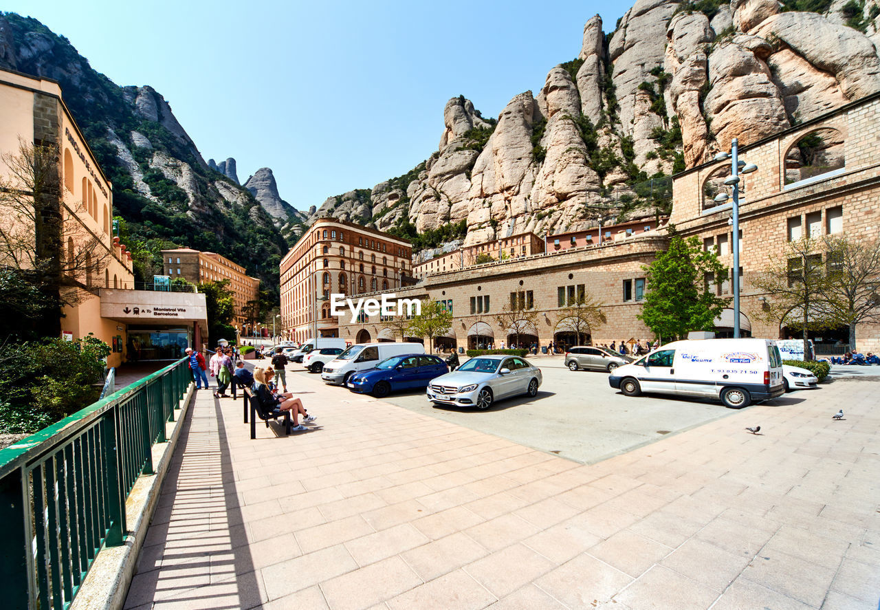 CARS ON ROAD AGAINST CLEAR SKY