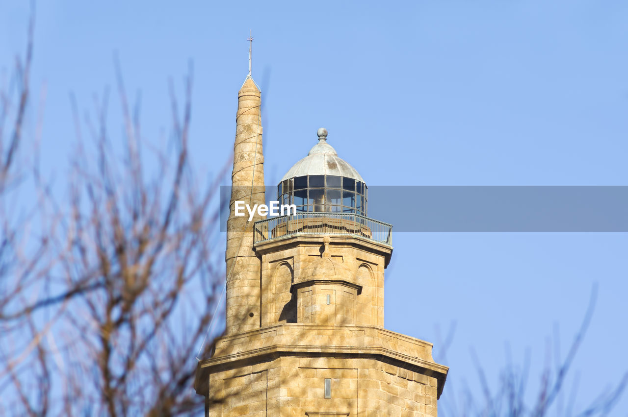 Tower of hercules against clear blue sky