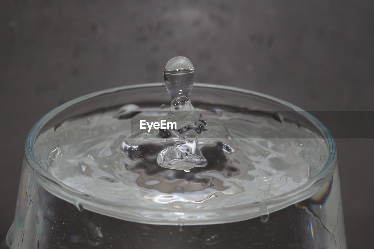 Close-up of water splashing in glass