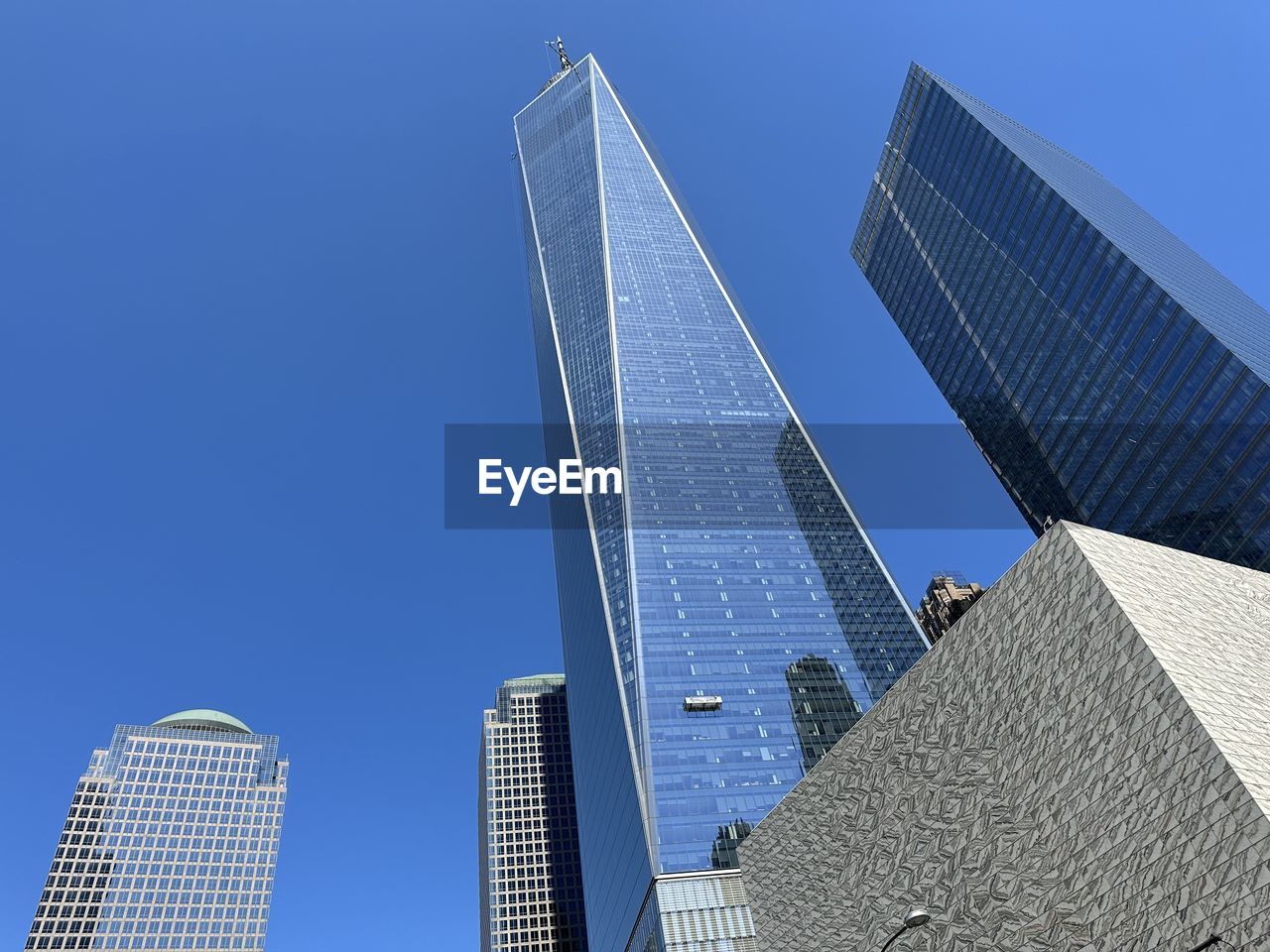 low angle view of modern building against clear blue sky