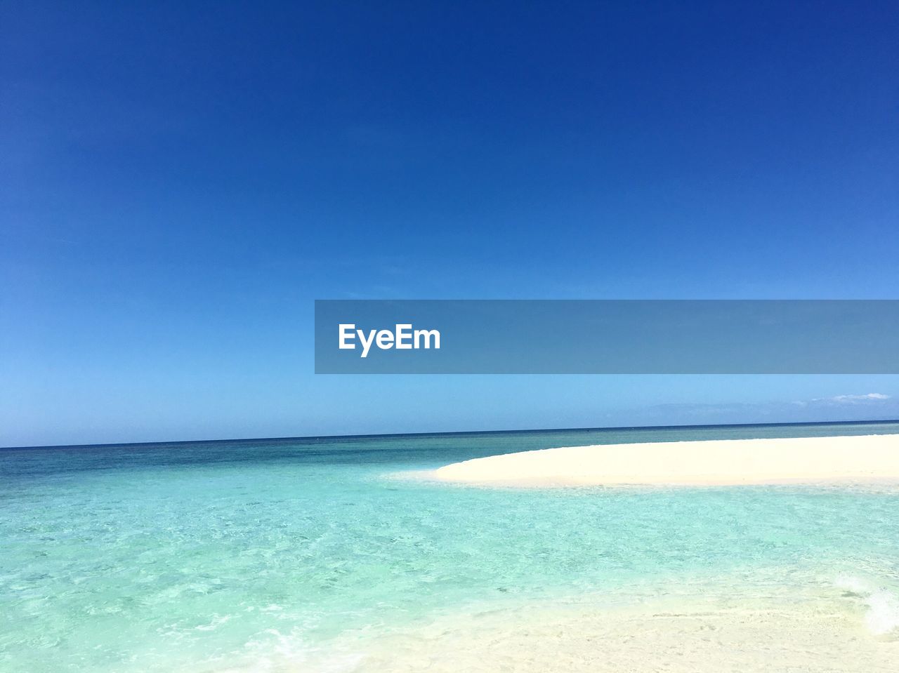 SCENIC VIEW OF SEA AGAINST BLUE SKY