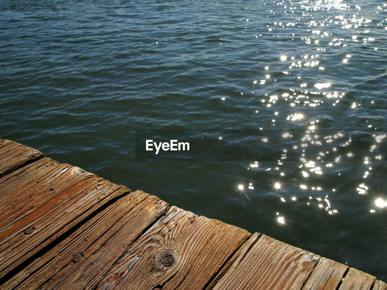 water, wood, sea, nature, reflection, no people, sunlight, day, tranquility, high angle view, beauty in nature, ocean, horizon, pier, outdoors, rippled, shore, scenics - nature, tranquil scene, wave