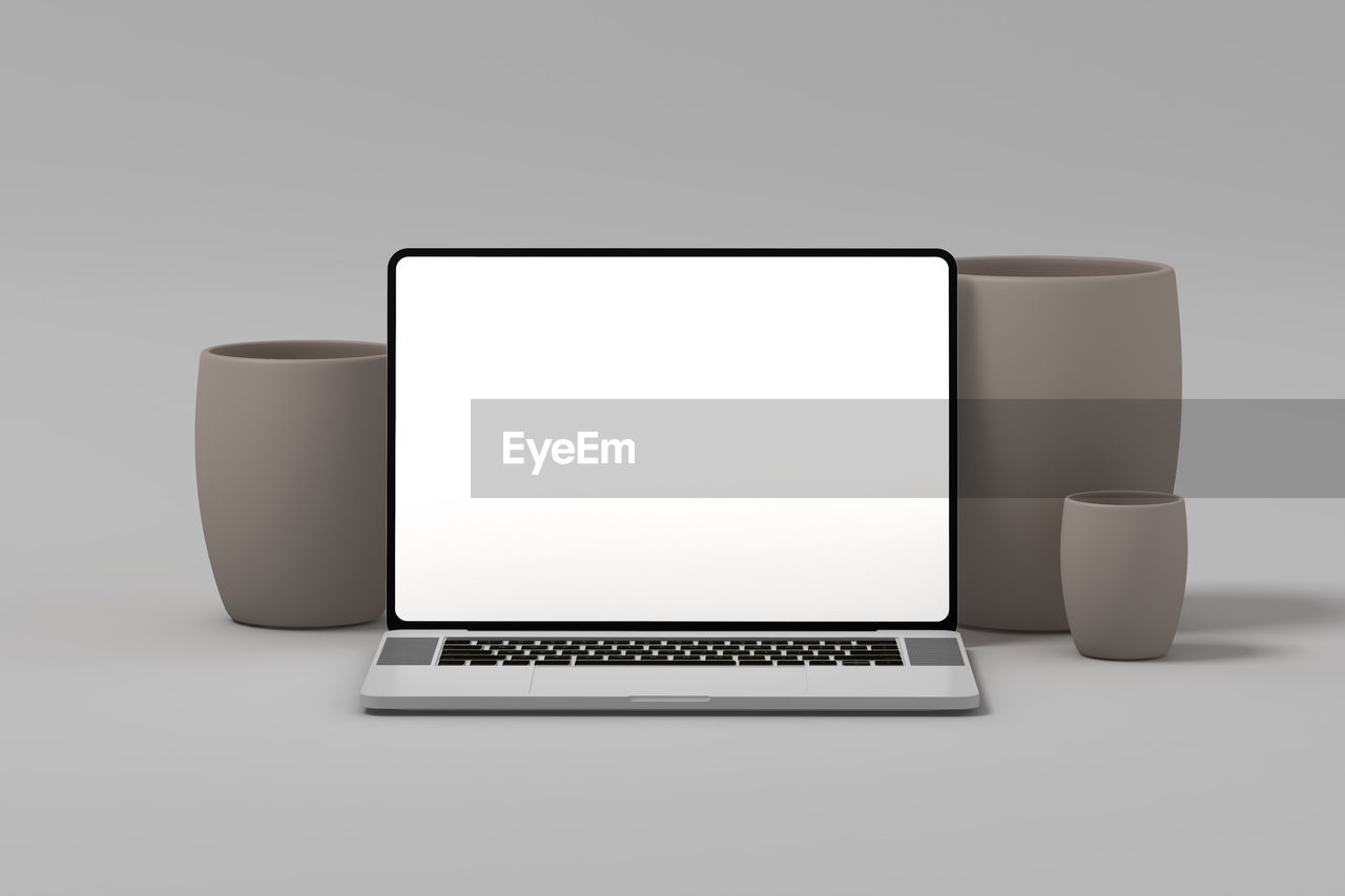 technology, computer, wireless technology, laptop, communication, computer equipment, copy space, internet, computer monitor, computer network, indoors, gray, desktop pc, studio shot, portable information device, no people, display device, portability, cut out, table, multimedia, business, white, device screen, three dimensional, smartphone, rectangle, simplicity