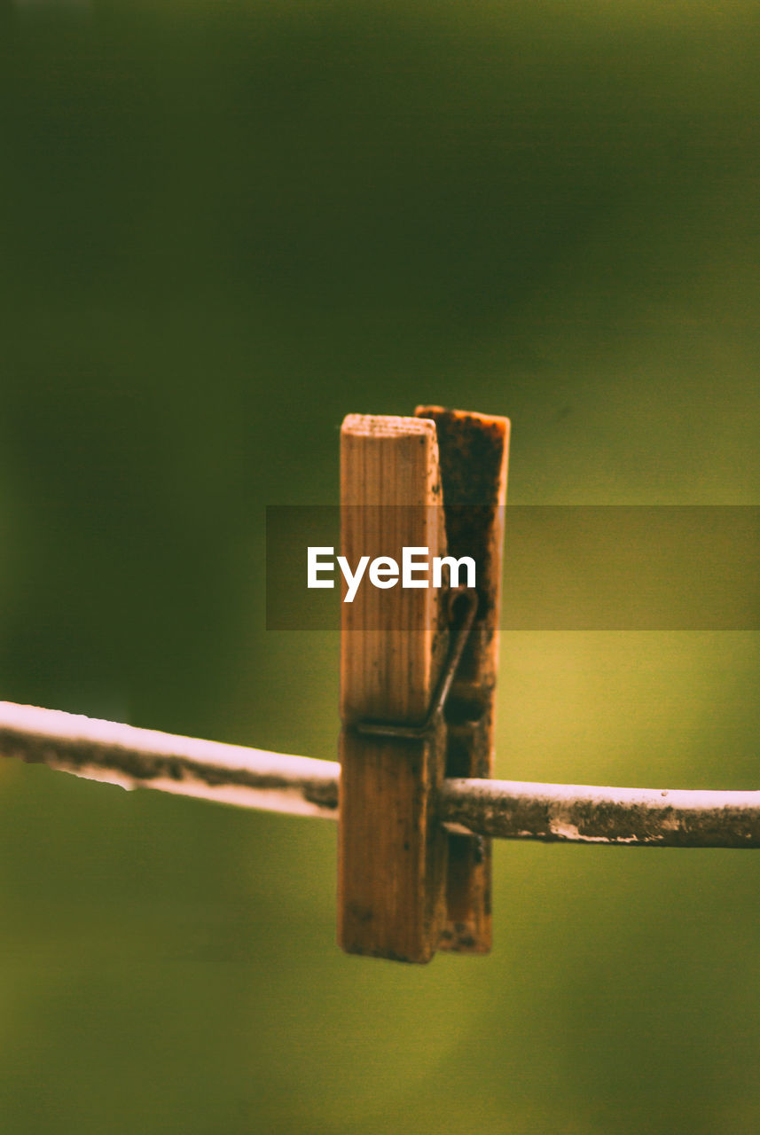 close-up of wooden post against blurred background