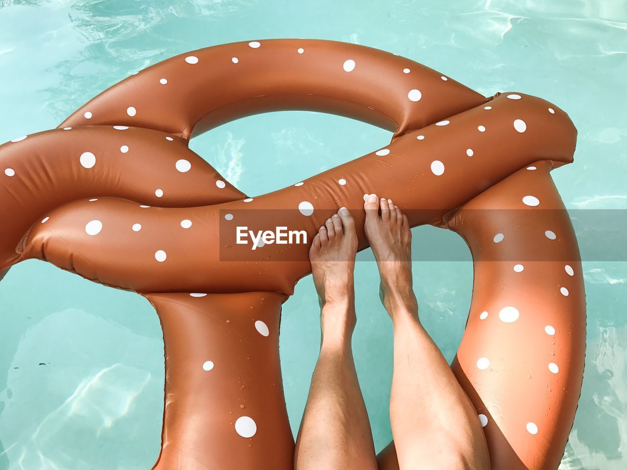 Low section of woman in swimming pool