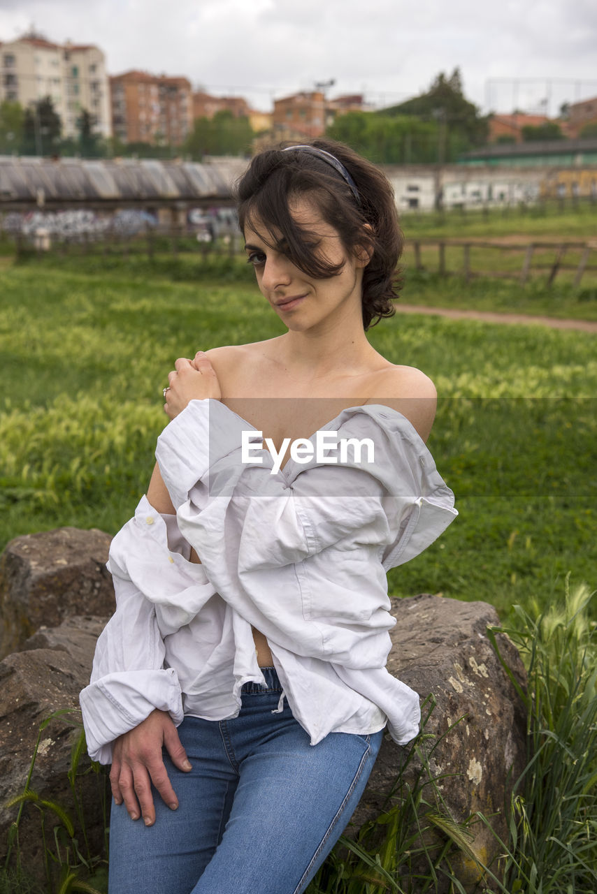 Woman sitting on a field