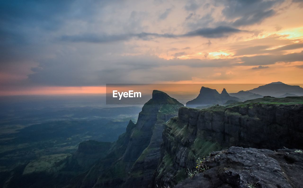 Scenic view of mountains against sky during sunset