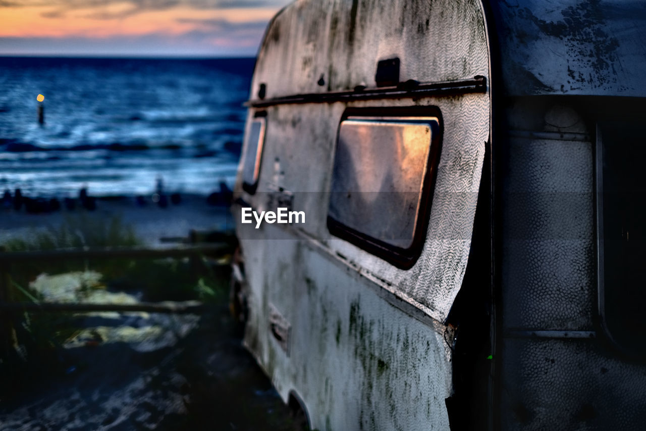 ABANDONED BOAT ON BEACH