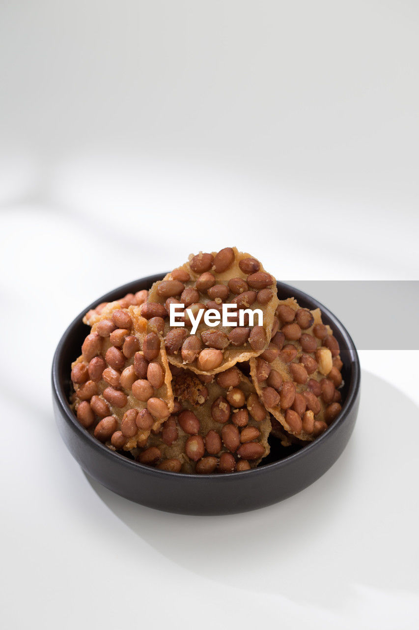 food and drink, food, studio shot, healthy eating, produce, white background, wellbeing, indoors, bowl, nut, nut - food, nuts & seeds, freshness, no people, fruit, still life, dried fruit, dried food, breakfast, close-up, cut out