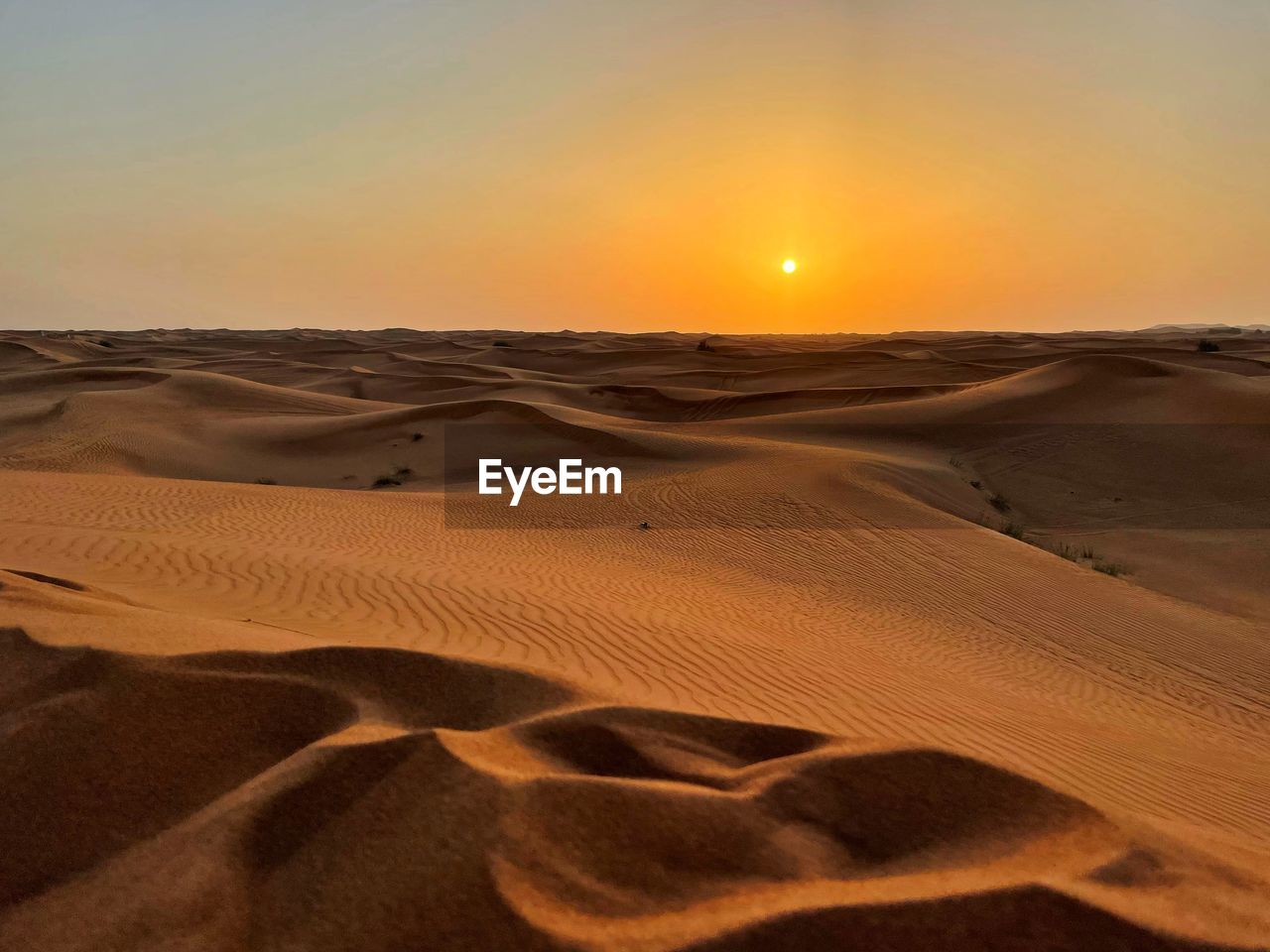 Scenic view of desert during sunset