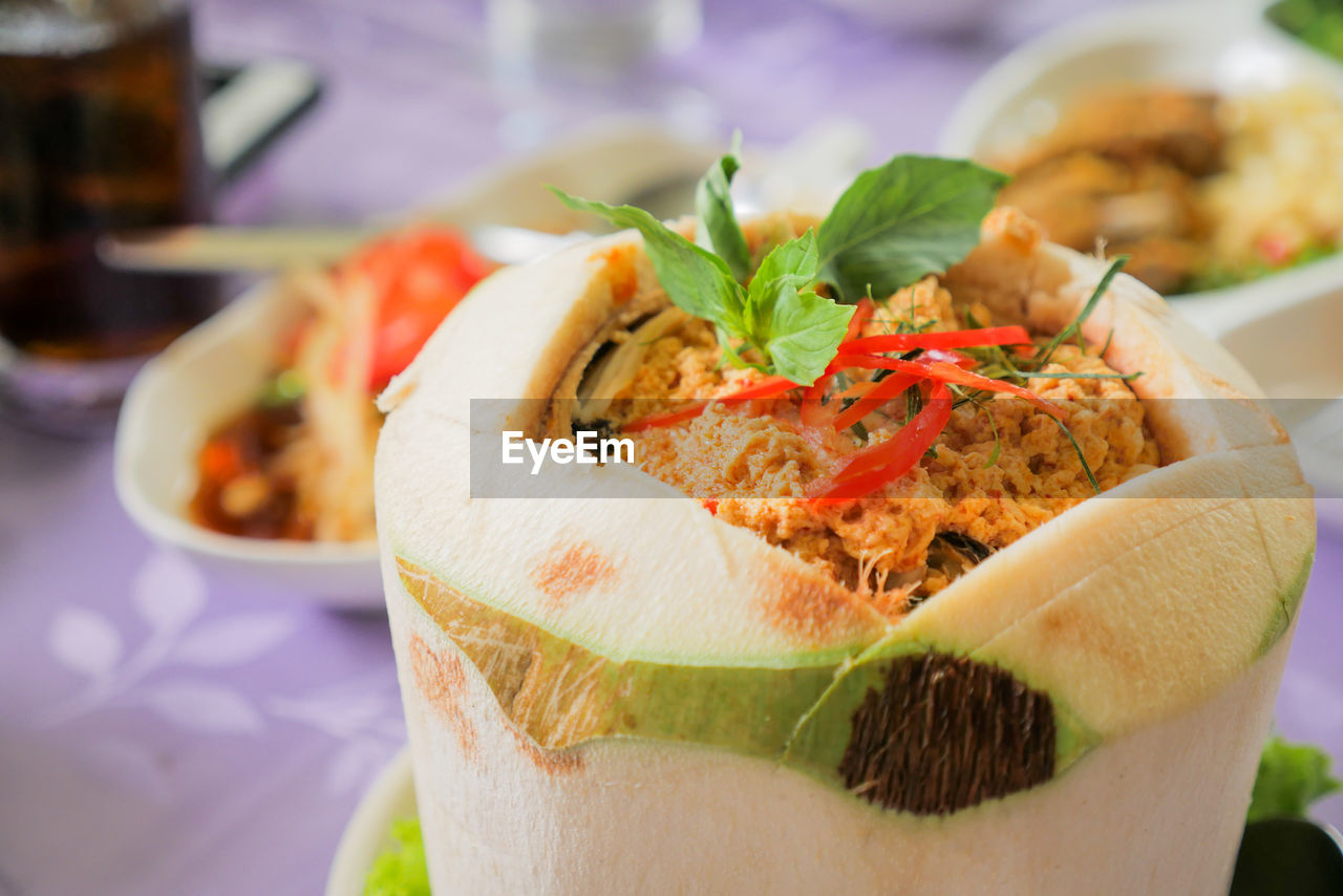 Close-up of food served in coconut shell
