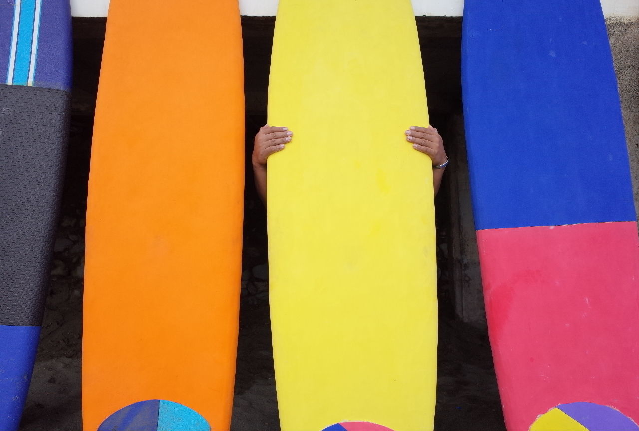 CLOSE-UP OF YELLOW FLAGS AGAINST BLUE BACKGROUND