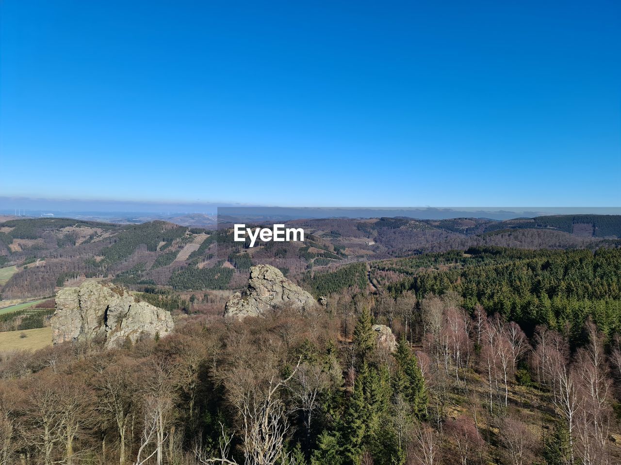Scenic view of landscape against clear blue sky