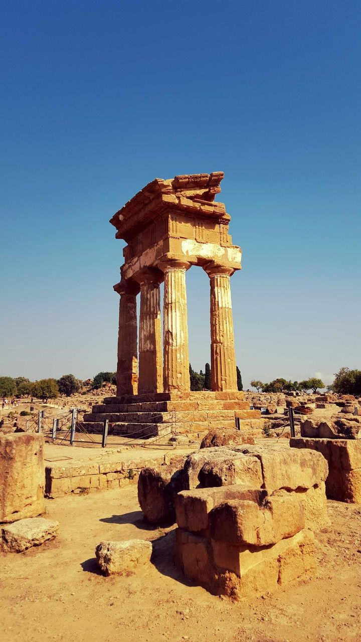 Old ruins at valley of temples against blue sky