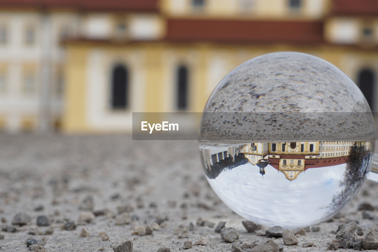 Close-up of crystal ball on land