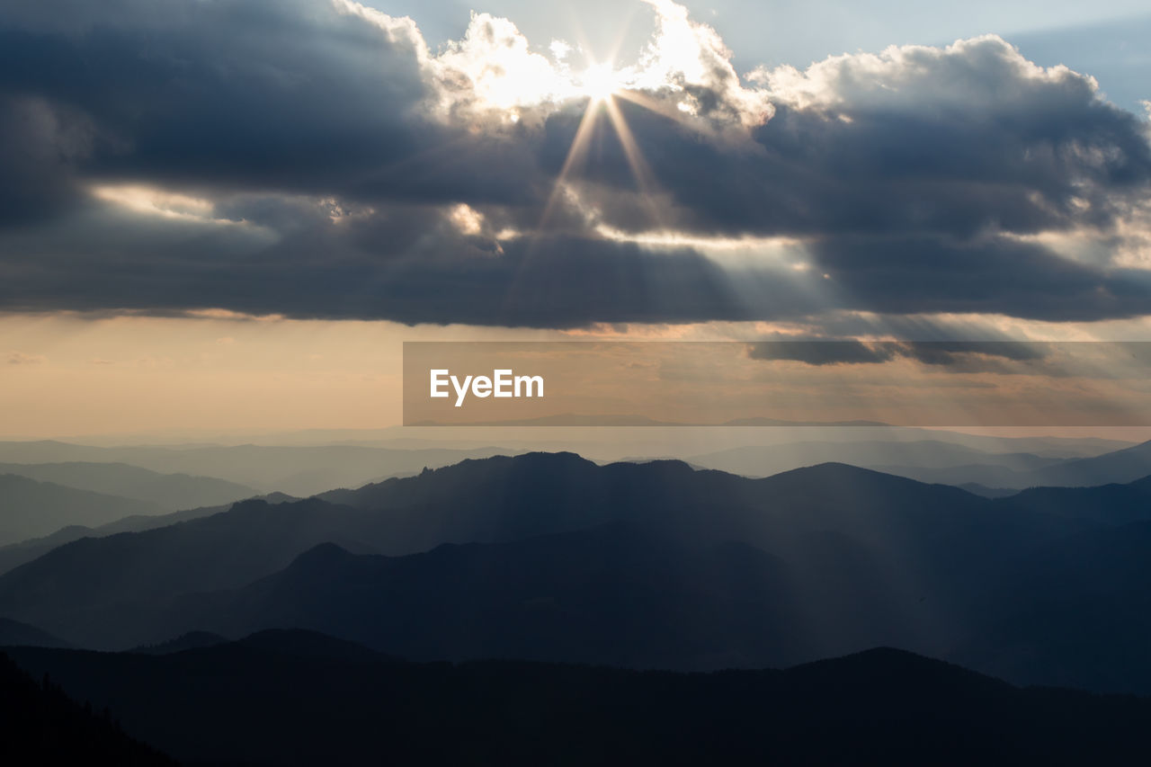 Scenic view of mountains against sky during sunset