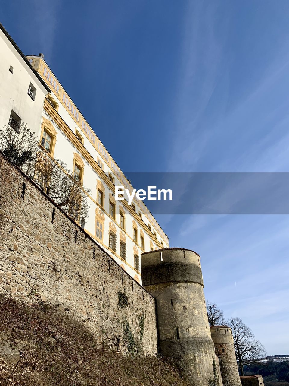 architecture, built structure, sky, building exterior, history, fortification, the past, wall, nature, building, fort, low angle view, no people, cloud, tower, wall - building feature, landmark, blue, day, outdoors, surrounding wall, travel destinations, fortified wall, travel, old, ancient history, castle