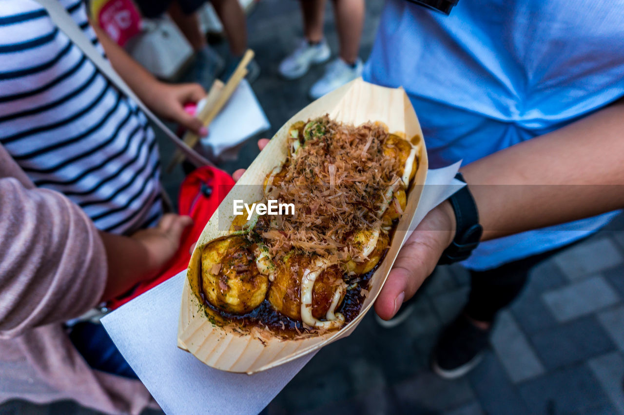 Close-up of person holding food