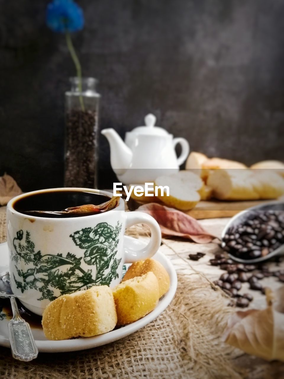 CLOSE-UP OF COFFEE CUP AND TEA