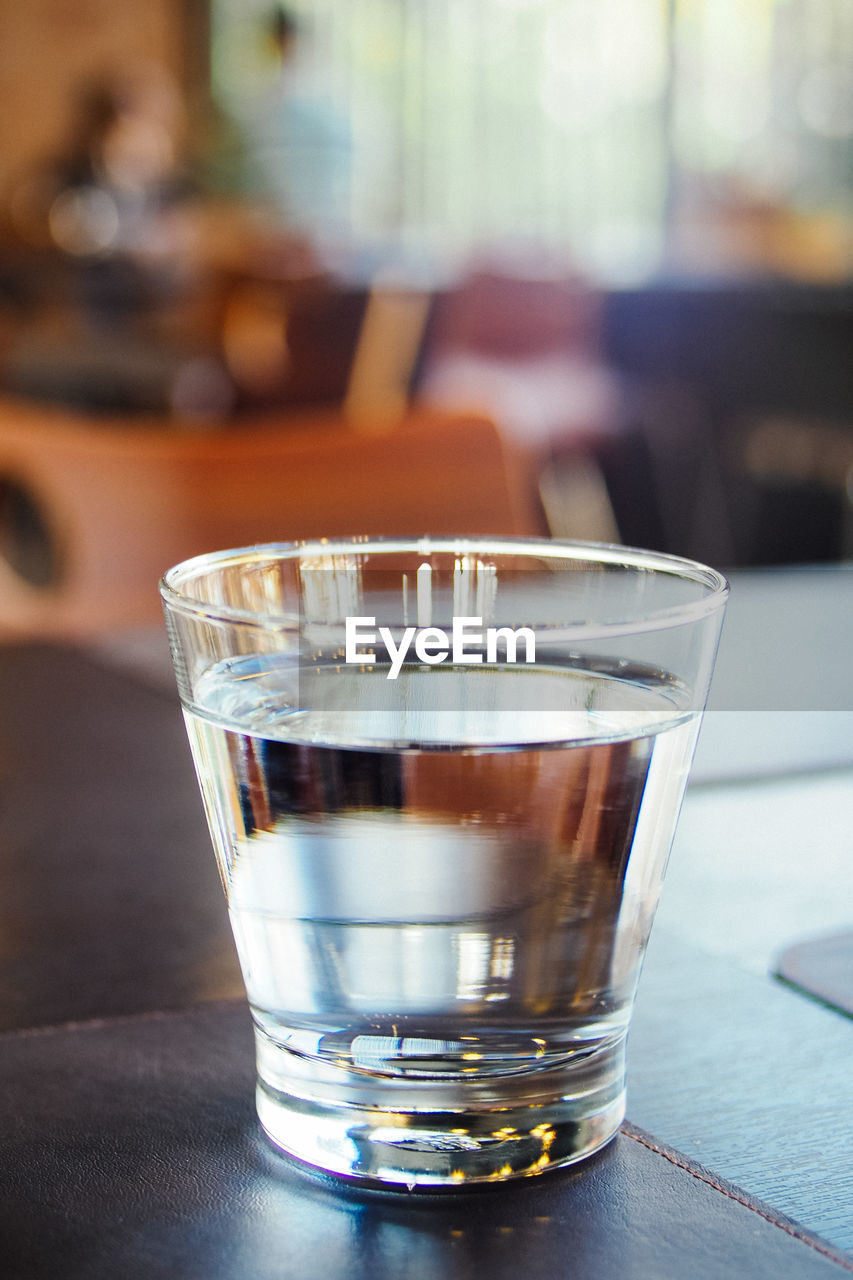 Close-up of water in glass on table at restaurant