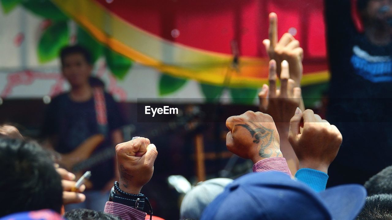 Arms raised at music concert