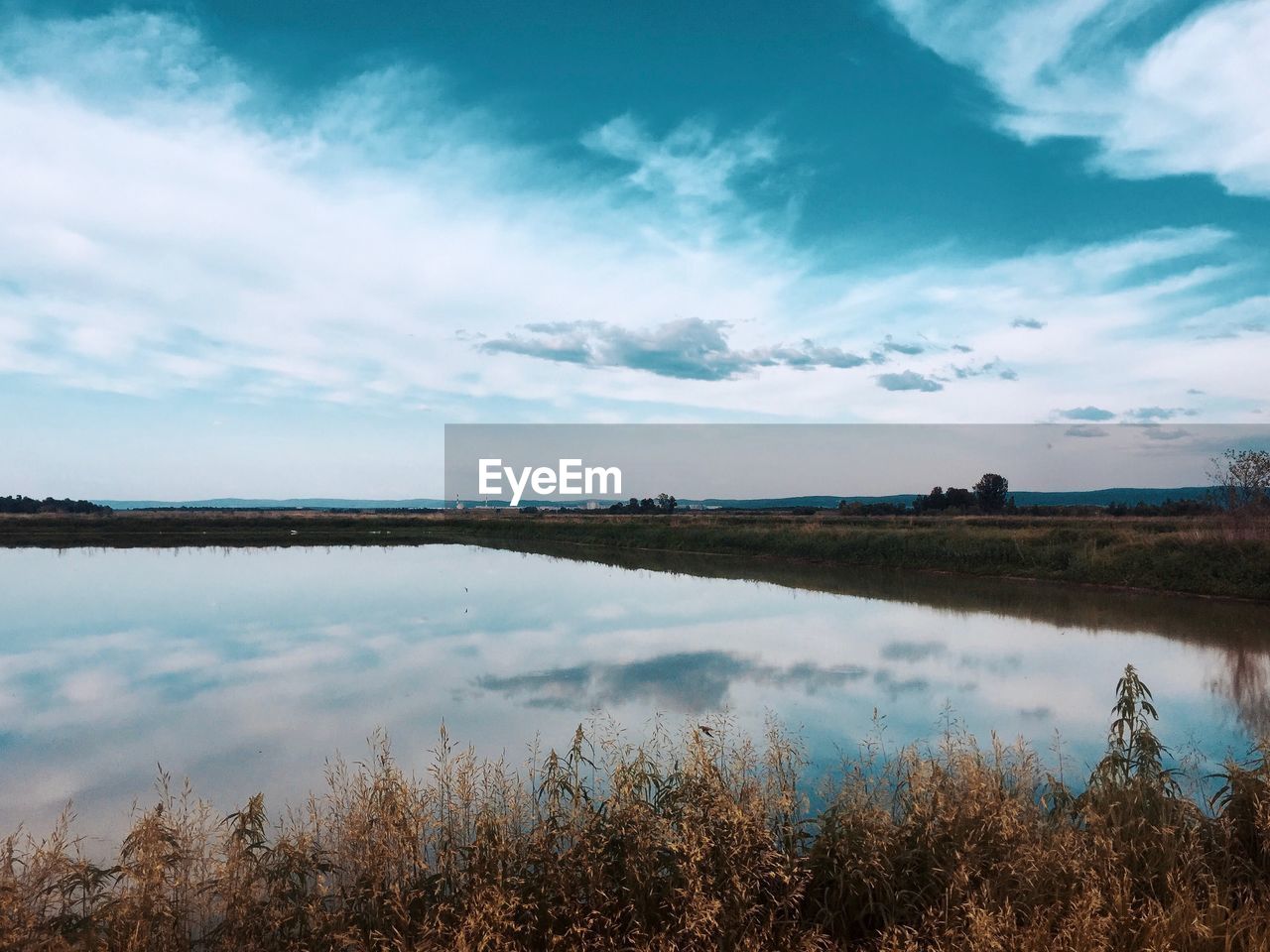 Scenic view of lake against sky