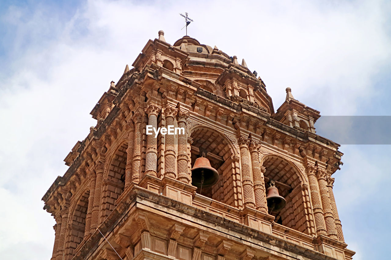 Baroque bell tower of the basilica menor de la merced on plaza de armas square, cusco city, peru