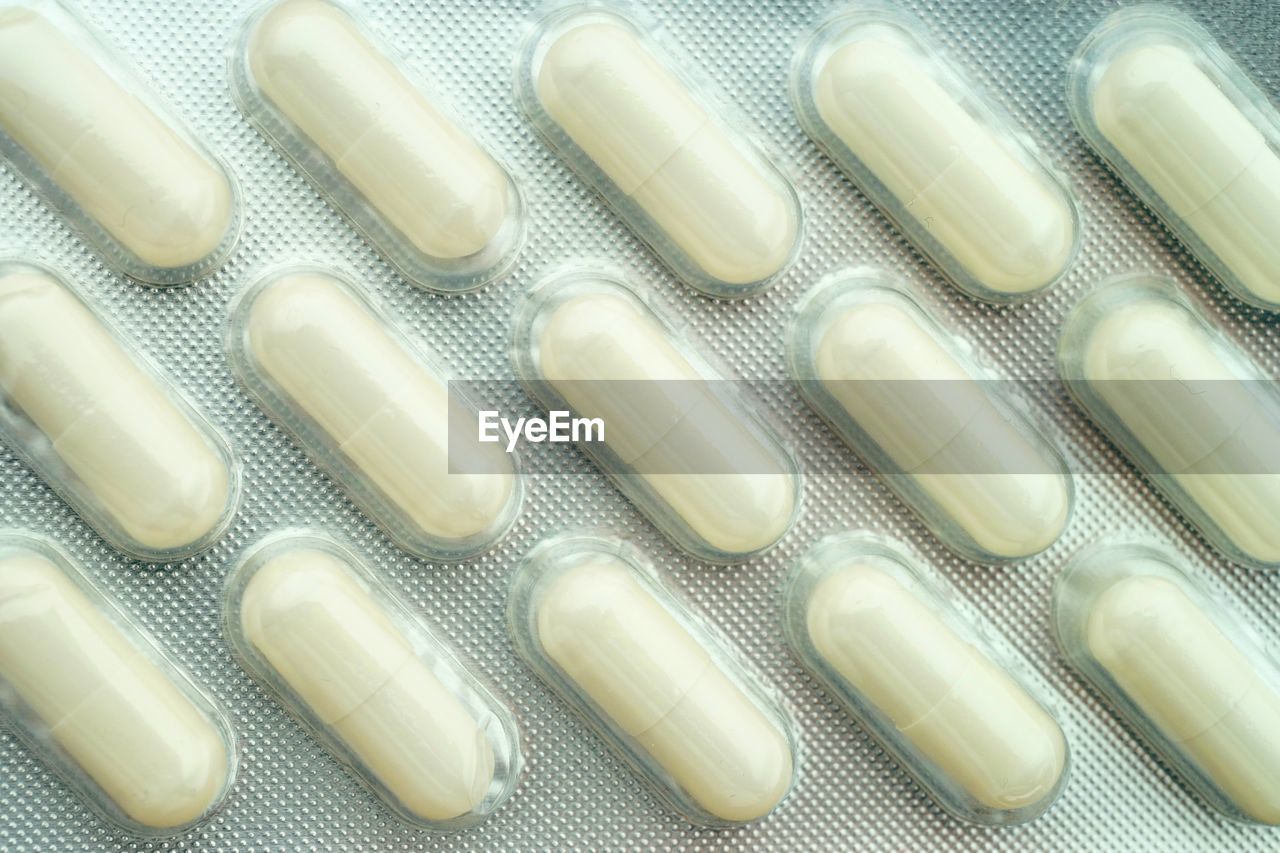 Full frame shot of pills in plastic packaging