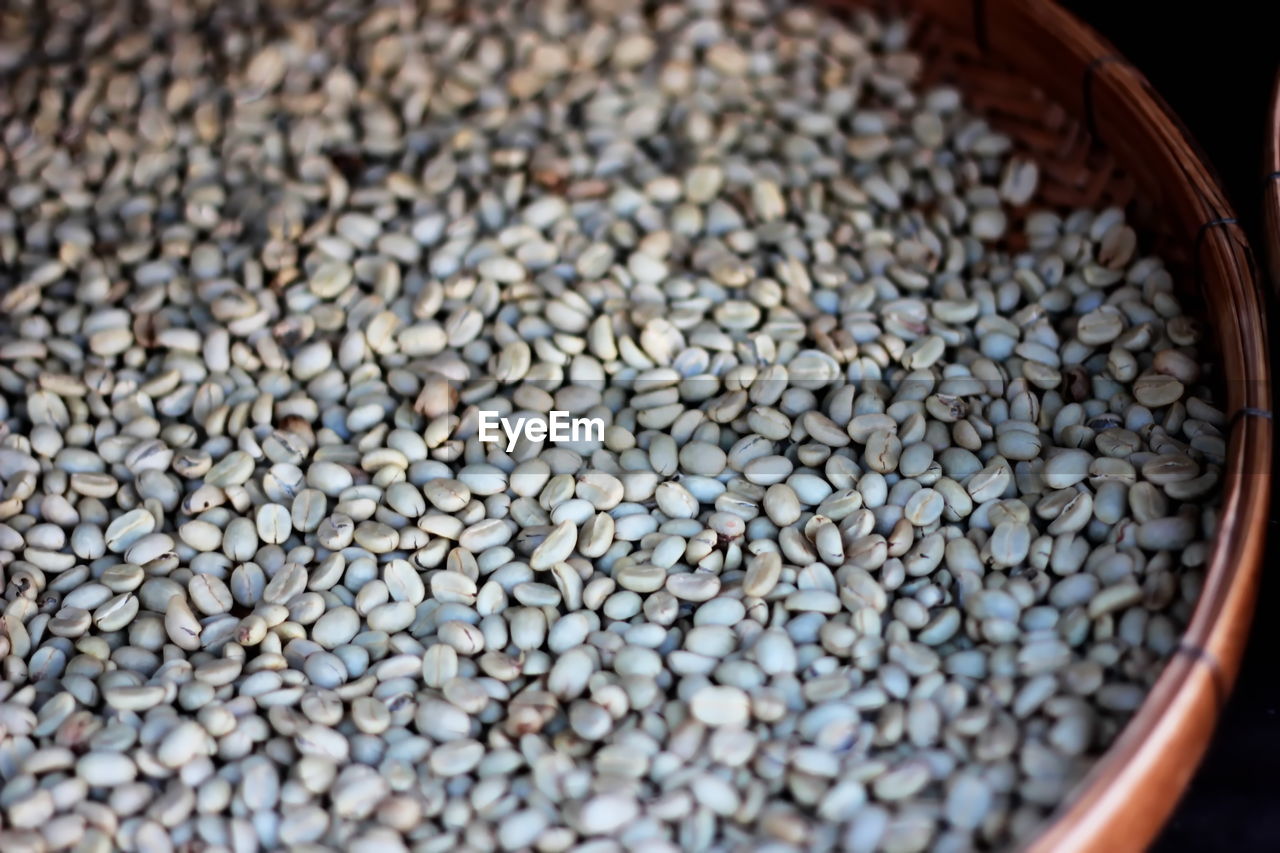 HIGH ANGLE VIEW OF COFFEE BEANS ON CONTAINER