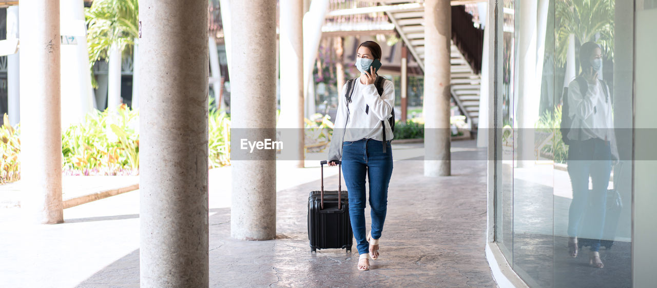 WOMAN WALKING IN BUILDING