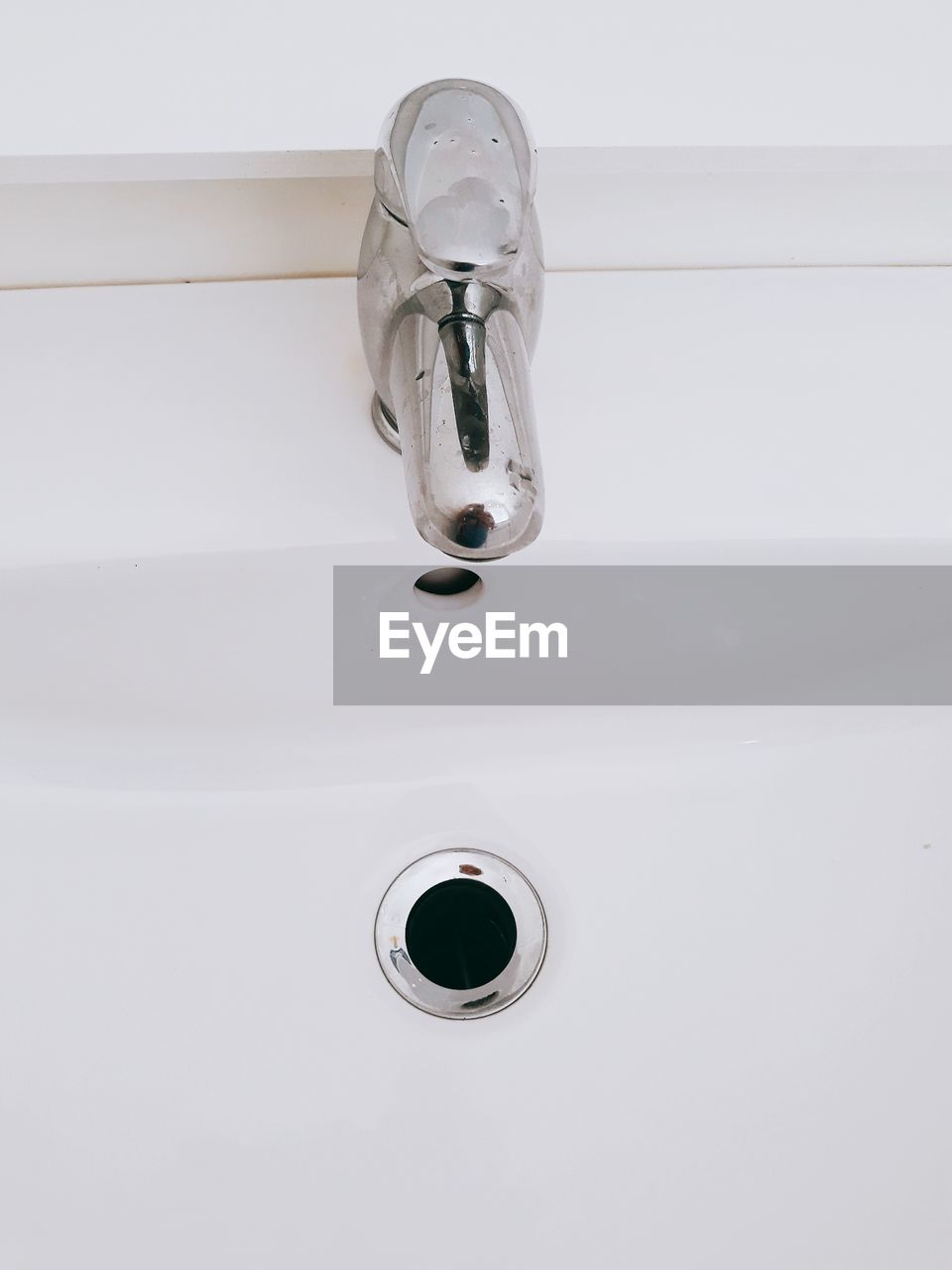 Close-up of faucet on sink in bathroom