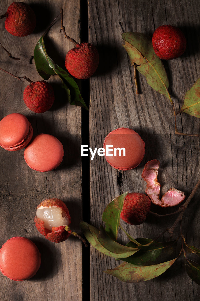 HIGH ANGLE VIEW OF FRUITS ON WOODEN TABLE