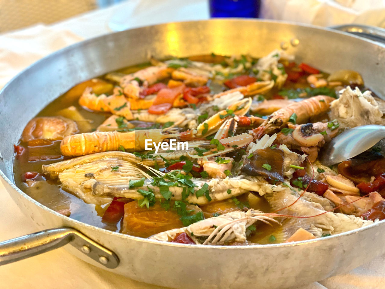 food, food and drink, healthy eating, dish, vegetable, cuisine, wellbeing, kitchen utensil, freshness, seafood, cooking pan, meal, household equipment, meat, no people, thai food, produce, stew, close-up, crustacean, dinner, heat, restaurant, animal, herb, shrimp, savory food