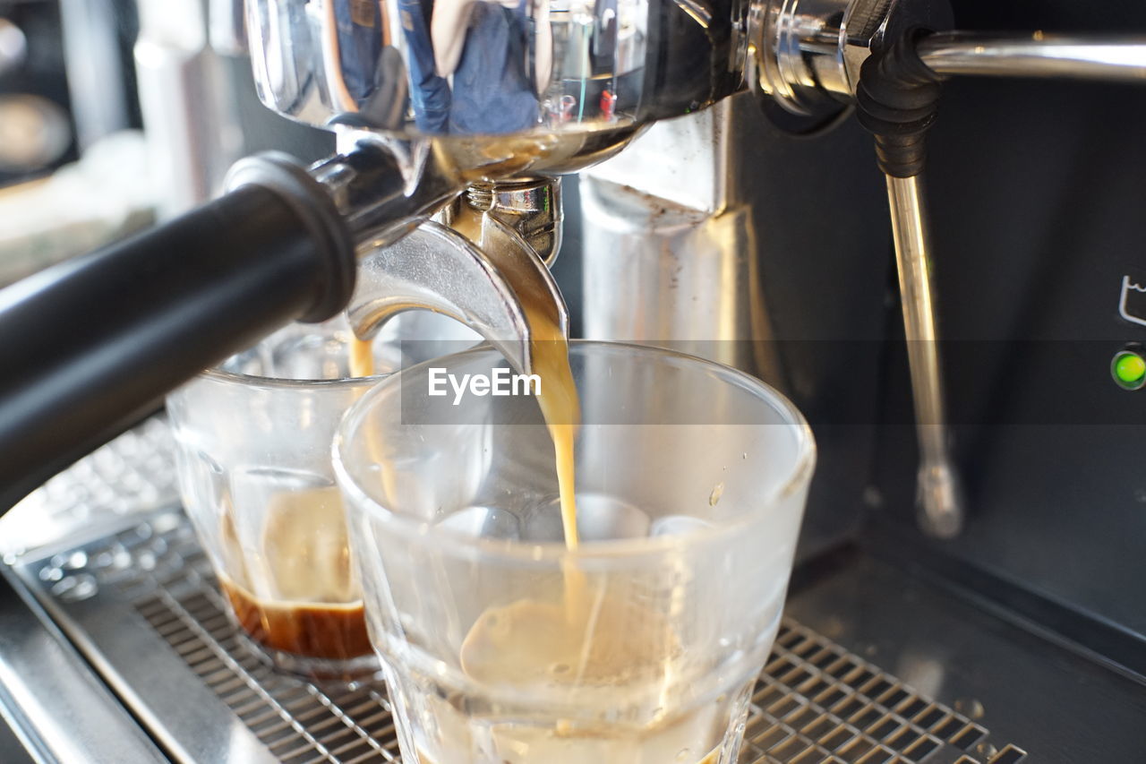 CLOSE-UP OF COFFEE POURING IN GLASS