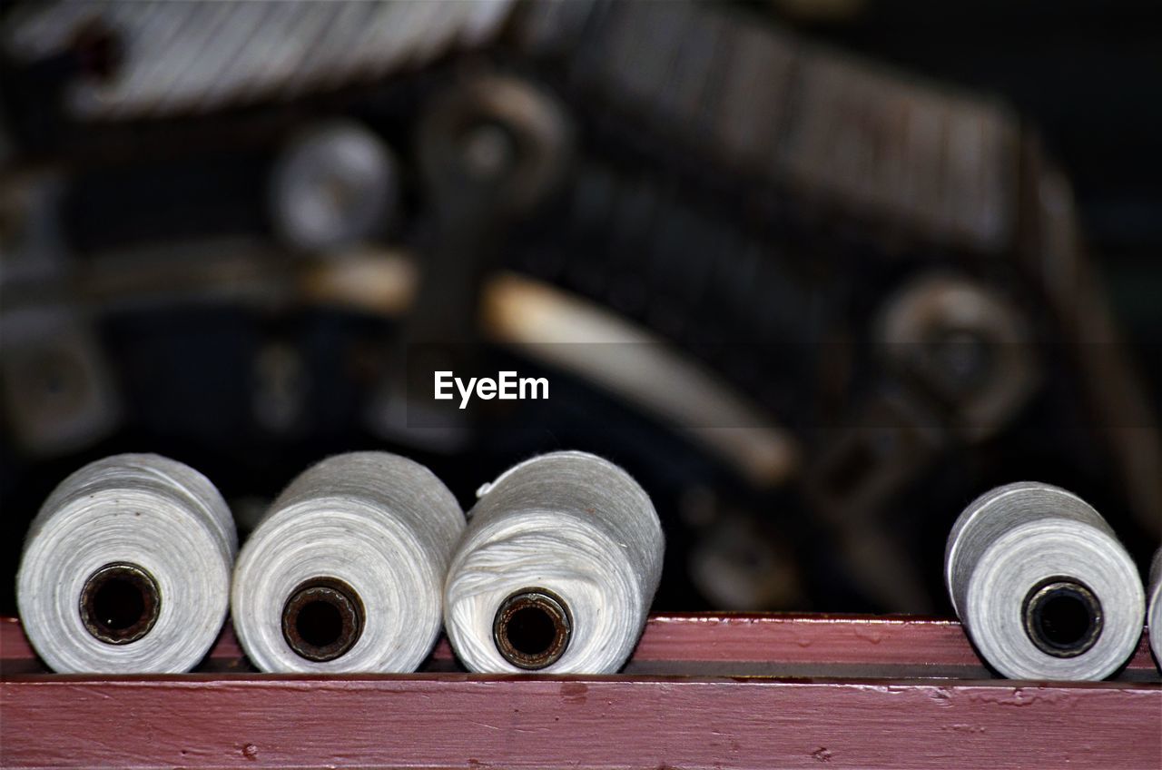 close-up, wheel, no people, iron, focus on foreground, wood, indoors