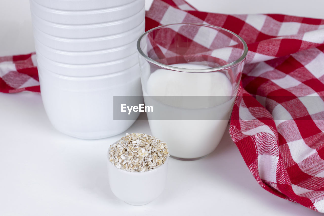 food and drink, food, studio shot, white, breakfast, indoors, milk, healthy eating, dairy, drink, checked pattern, wellbeing, white background, container, no people, meal, refreshment, household equipment, striped, red, bowl, freshness, cup, milk jug