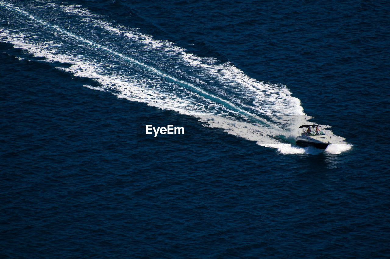 High angle view of jet boat sailing on sea