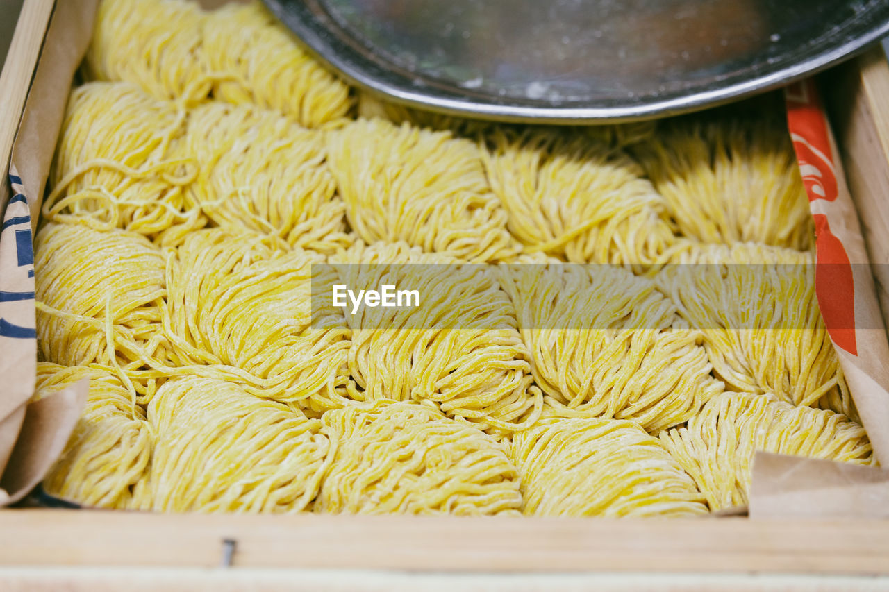 High angle view of fresh ramen noodles in wooden container