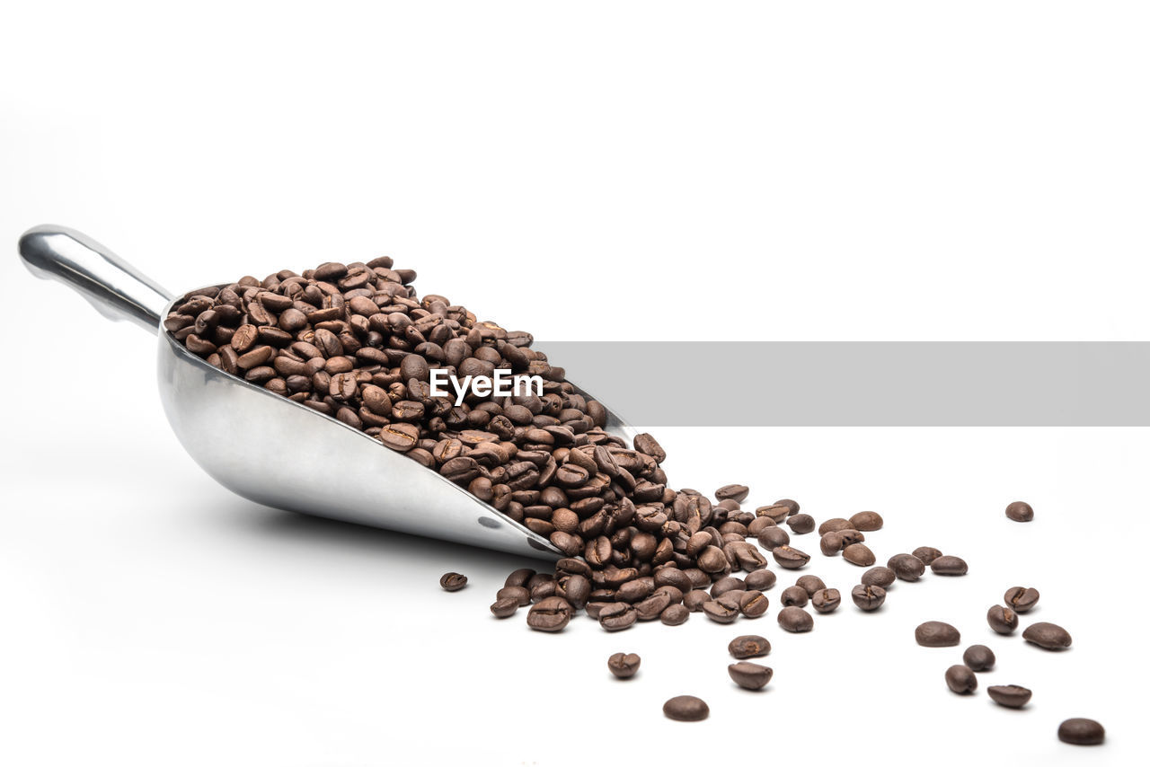 HIGH ANGLE VIEW OF COFFEE BEANS IN BACKGROUND