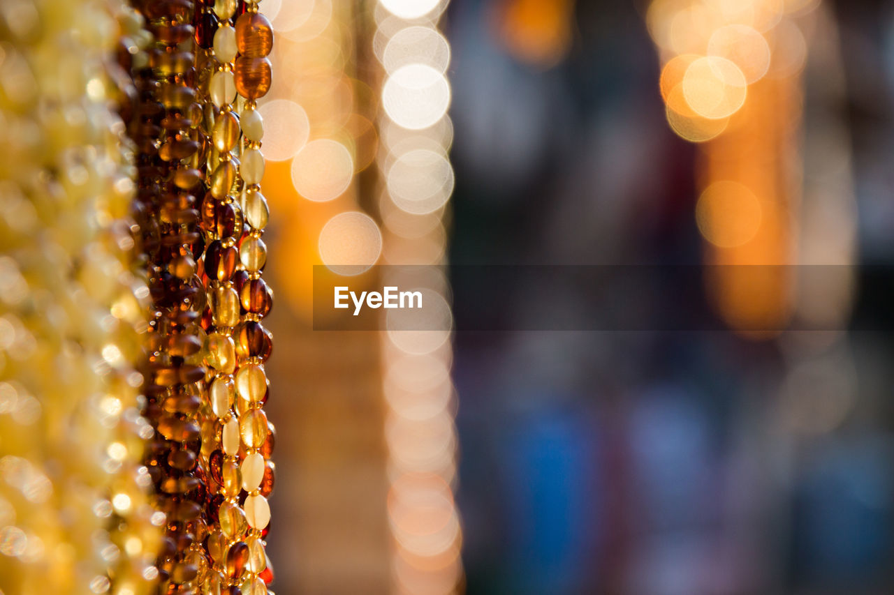 CLOSE-UP OF ILLUMINATED LIGHTING EQUIPMENT AT MARKET