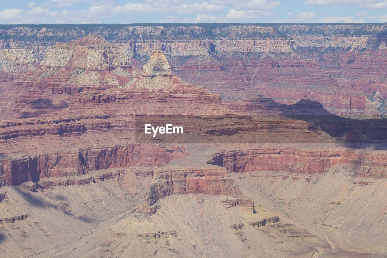 rock, landscape, rock formation, canyon, environment, scenics - nature, travel destinations, non-urban scene, nature, geology, beauty in nature, land, desert, travel, physical geography, no people, tranquil scene, tranquility, eroded, day, tourism, arid climate, extreme terrain, outdoors, climate, escarpment, remote, barren, sky, cloud, idyllic, mountain, wadi