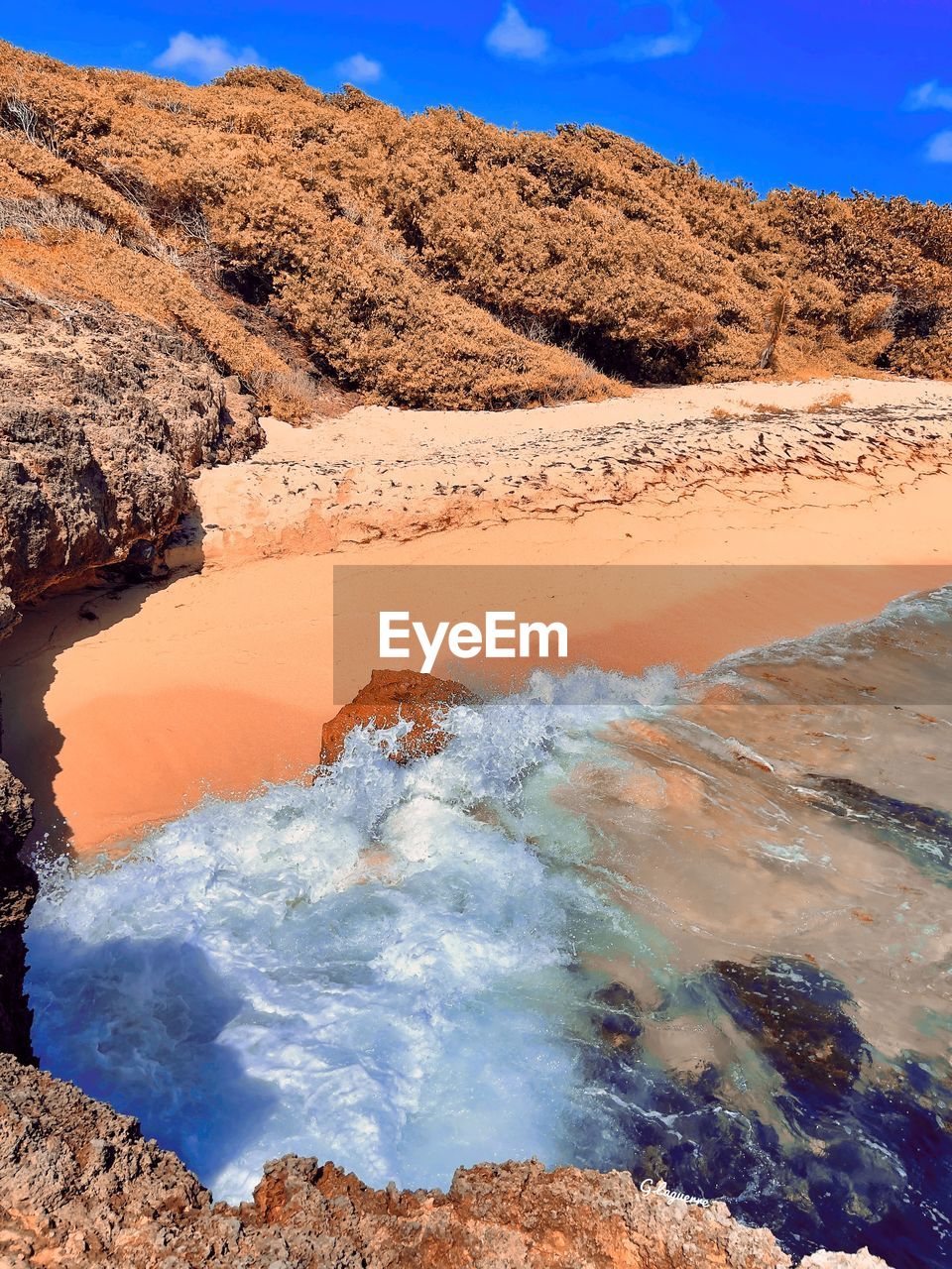 scenic view of beach against clear sky