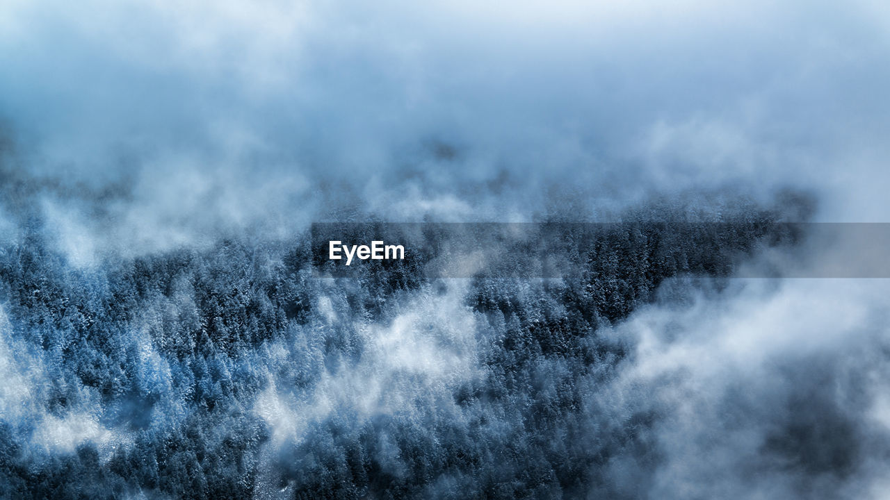 Scenic view of snow covered landscape against sky