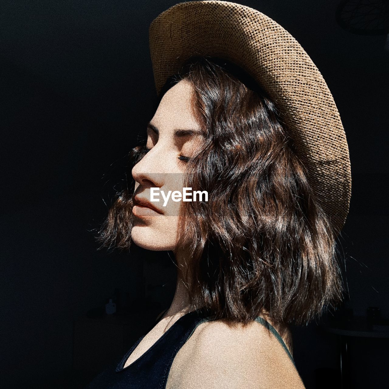 Close-up of woman wearing hat