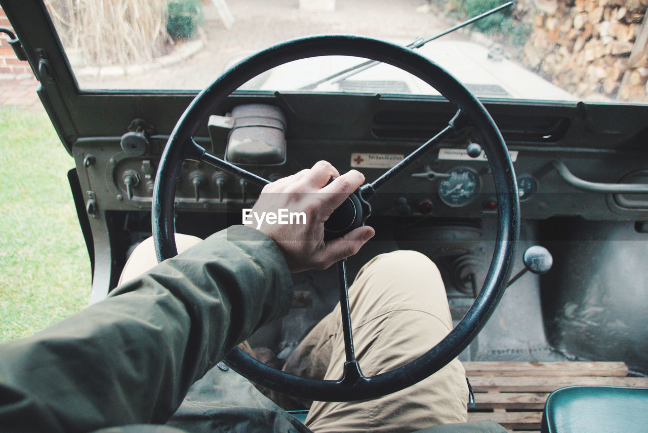 Close-up of man driving car