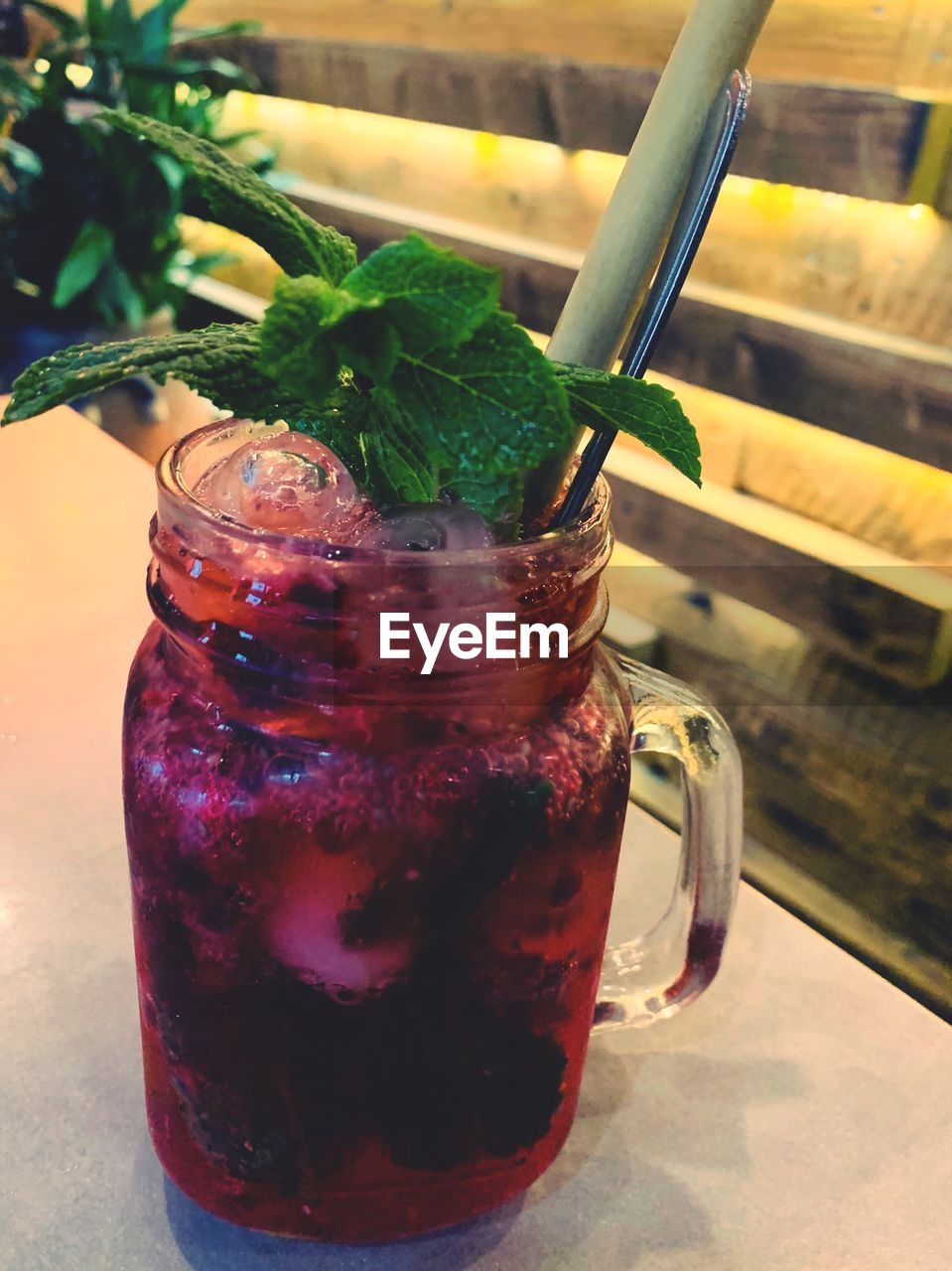 CLOSE-UP OF DRINK IN GLASS