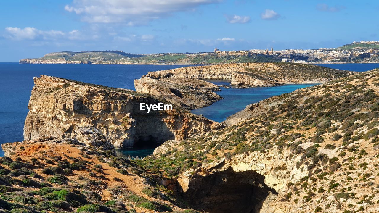 Scenic view of bay against sky