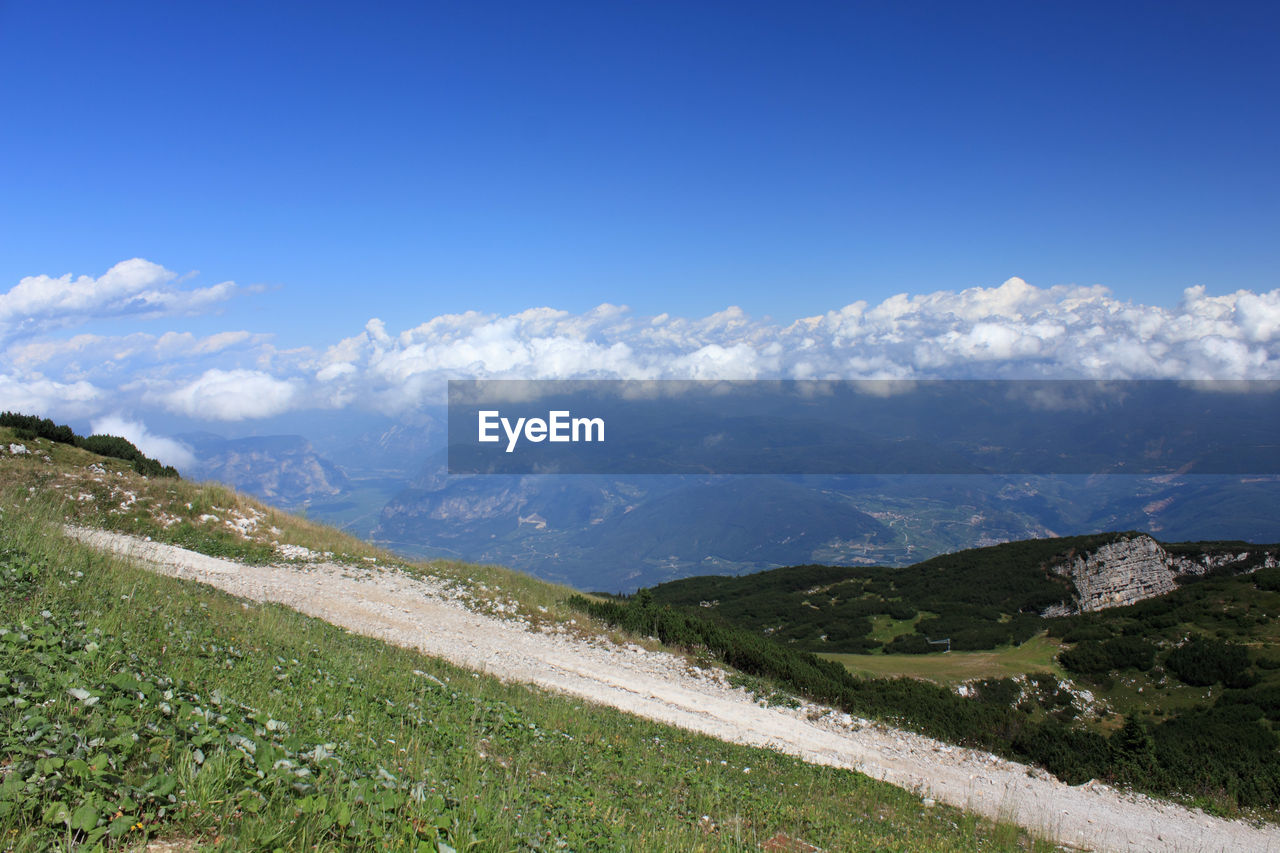 Scenic view of landscape against blue sky