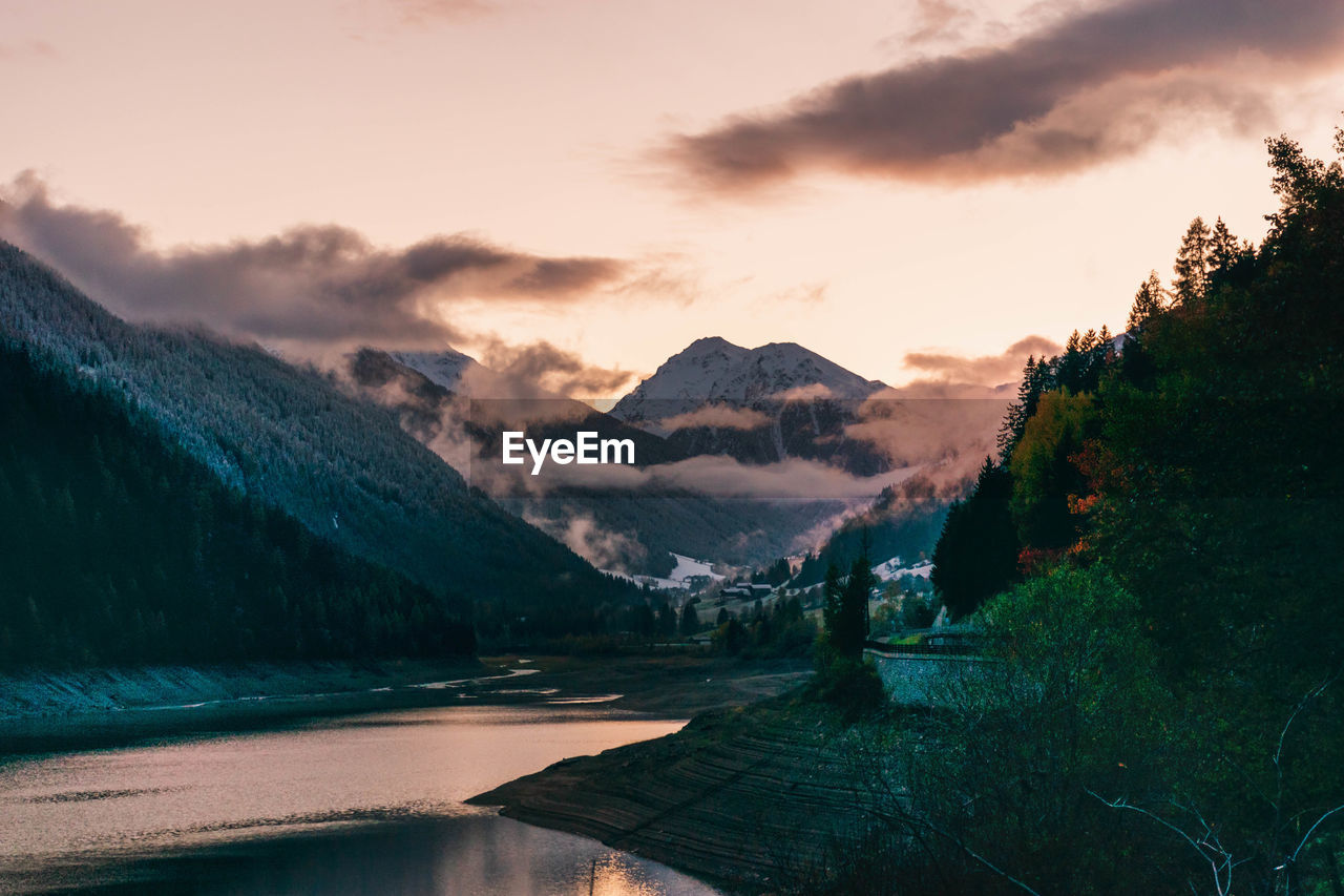 scenic view of mountains against sky during sunset