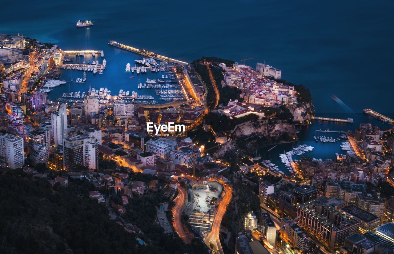 Aerial view of illuminated city at night